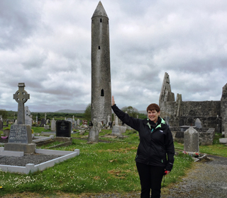Molly steadies the leaning tower at Kilmacduagh